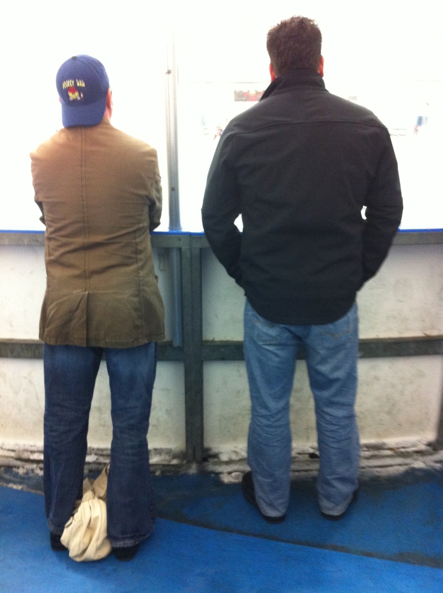 hockey dads watching a game